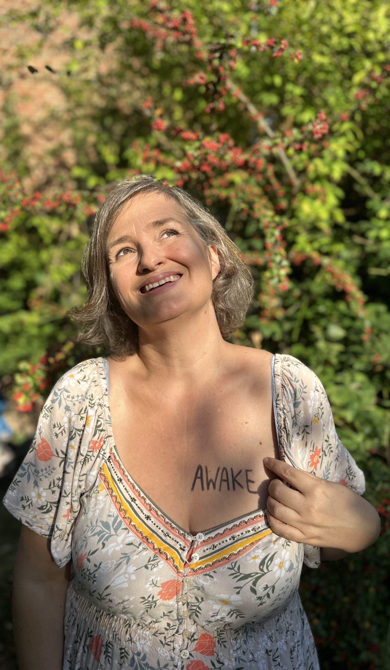 Michèle looks to the sky and is 'awake' written on her heart